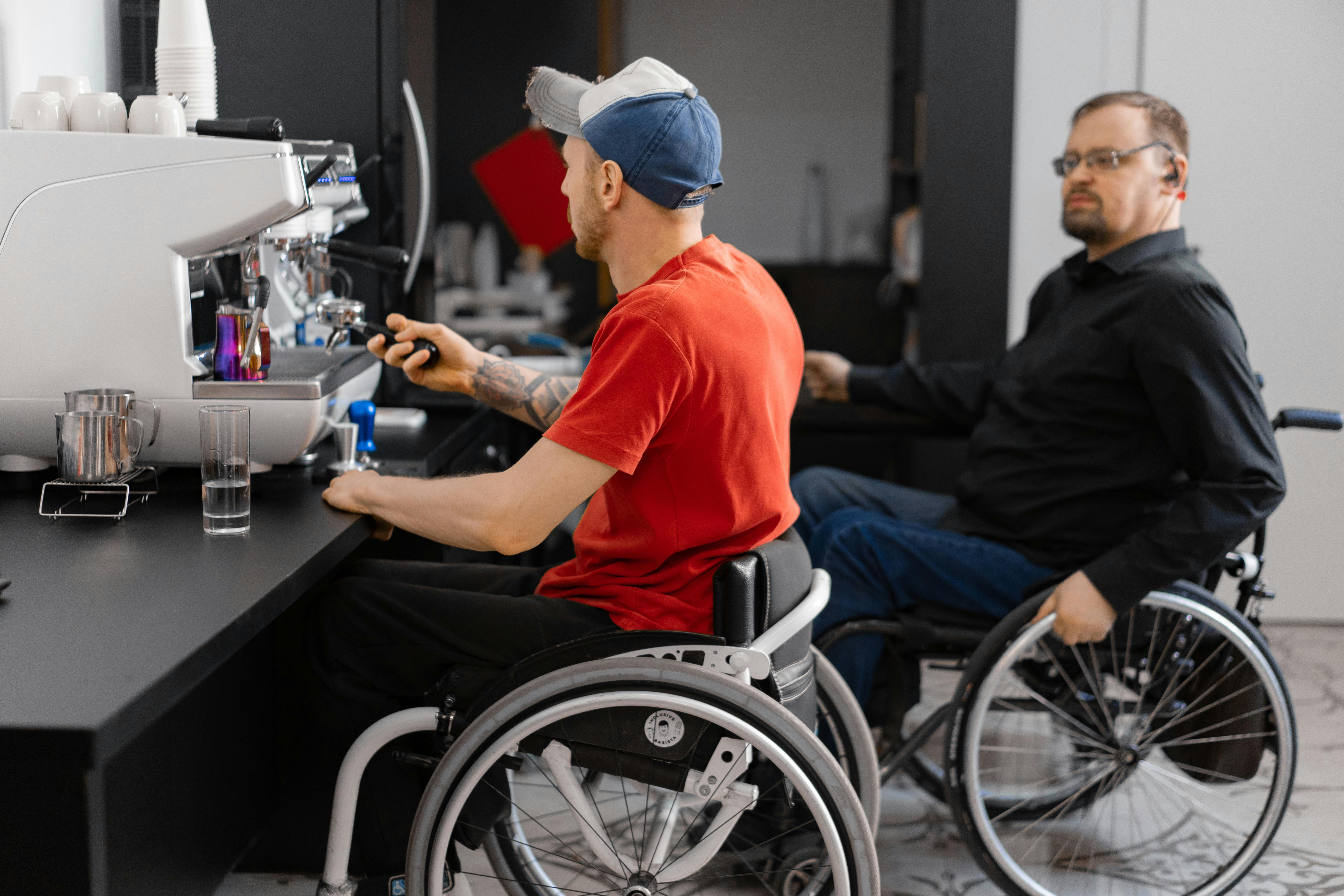 Two employees working together at a coffee shop counter — the kind of inclusive workplace MyPath supports across 15 locations.