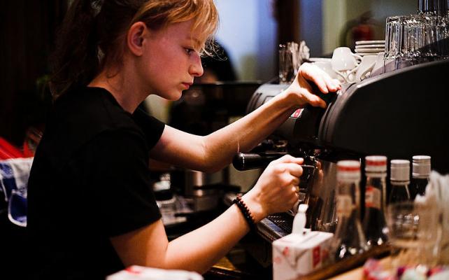 Girl makes espresso